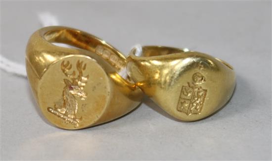 An 18ct gold signet ring and a similar yellow metal signet ring.